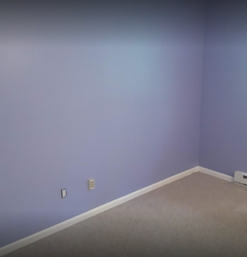 Smooth, flawless drywall finish on a freshly painted room